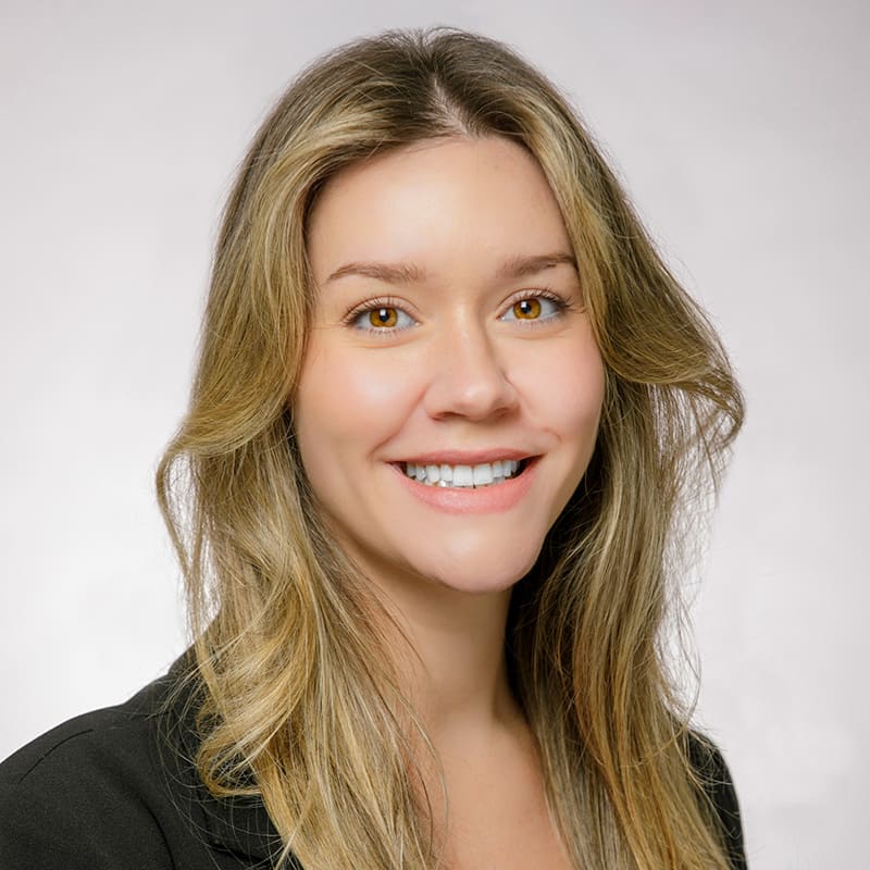 Portrait of Katie Fountain in a black blazer.